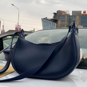 The navy blue crescent-shaped bag